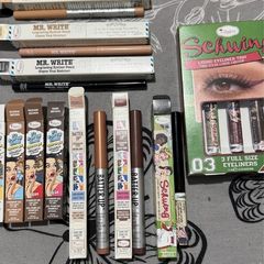 The balm tinted brow gel, clear brow gel, white, black eye pencils, liquid eyeliners