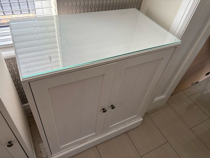 Solid wood cabinet in white with glass top