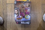 The item shown is the WWE Elite Collection Series 86 SummerSlam Seth Rollins action figure by Mattel, featuring his pink and black ring gear, TrueFX facial detailing, and themed accessories.