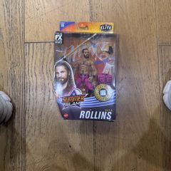 The item shown is the WWE Elite Collection Series 86 SummerSlam Seth Rollins action figure by Mattel, featuring his pink and black ring gear, TrueFX facial detailing, and themed accessories.