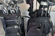 A selection of golf clubs and bags.