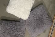 3 fluffy cushions