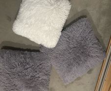 3 fluffy cushions