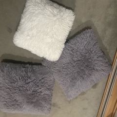 3 fluffy cushions