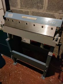 Sheet metal folding machine