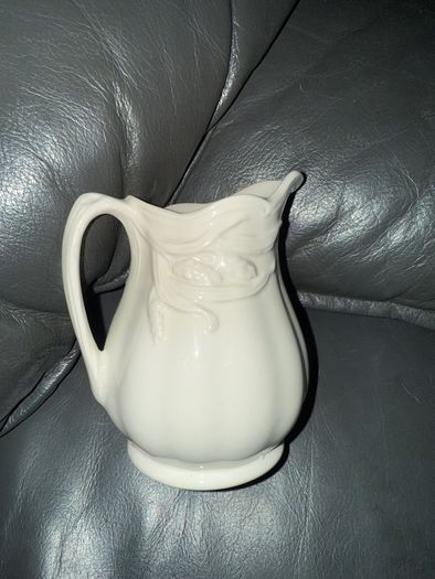 An antique Weatherby Design ironstone pitcher and bowl set featuring a wheat pattern.