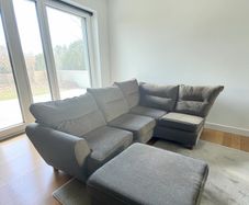 grey corner sofa with matching footstool