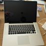 magsafe 1 charger + a macbook pro Image 2