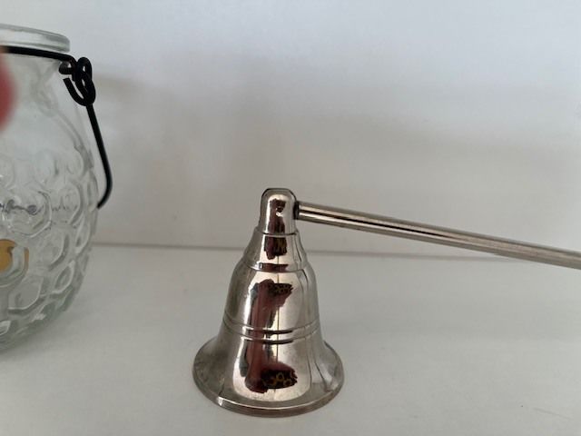 Metal Handle Candle Snuffer. Silver Finish. Moveable Head. With Hanging Tea Light. In Excellent Condition.
