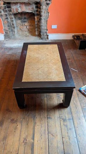 coffee table, black lacquered with rattan inset
