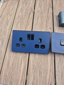 Navy blue socket and light switch