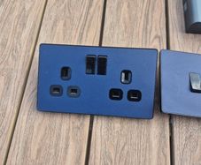 Navy blue socket and light switch