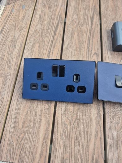 Navy blue socket and light switch