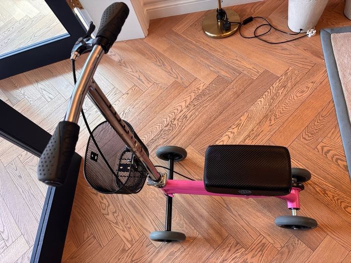 Kneerover Junior mobility knee scooter in pink. Well-used, but still working well!