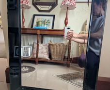 Mirror with black glass frame