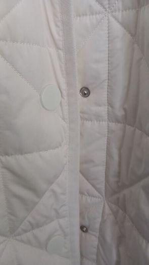 Capsule White Quilted Longline Coat.