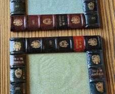 Vintage pair of leather book style photo frames