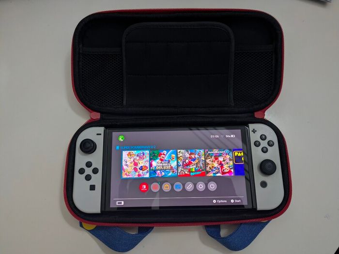 Nintendo Switch OLED (In the box) + Case + Super Mario Odyssey + Bomberman