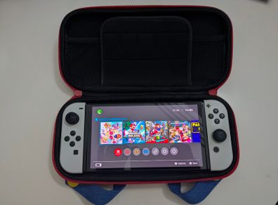 Nintendo Switch OLED (In the box) + Case + Super Mario Odyssey + Bomberman