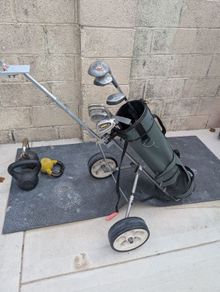 Cheap set of golf clubs and trolley