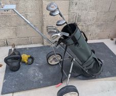 Cheap set of golf clubs and trolley