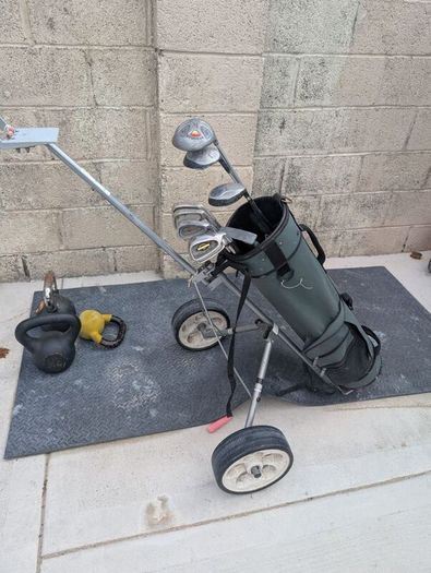 Cheap set of golf clubs and trolley