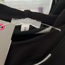 Naya black hooded top with white piping and design down back Image 3