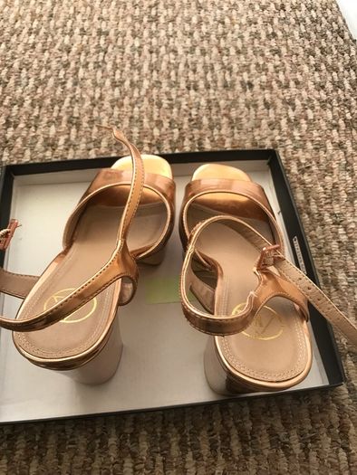ladys shoes rose gold only wore once. Practically new.