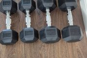 two sets of used hexagonal dumbbells