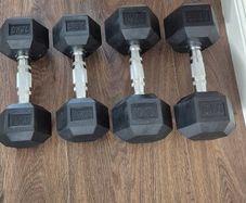 two sets of used hexagonal dumbbells
