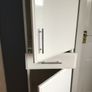 Tall white storage unit with drawer Image 2