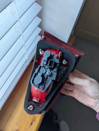 Genuine Hella rear tail light for Audi A4 B8 Sedan.