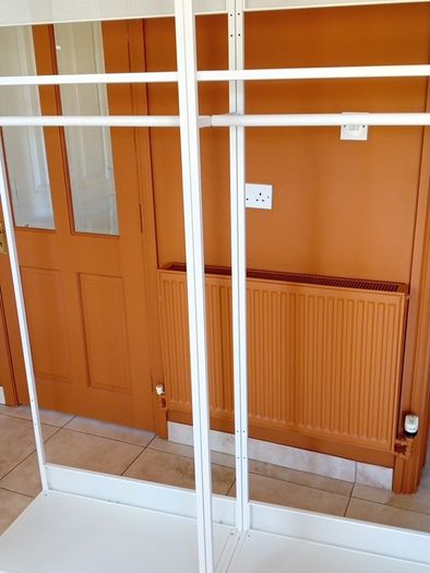 Two open wardrobe hanging rails Ikea Platsa