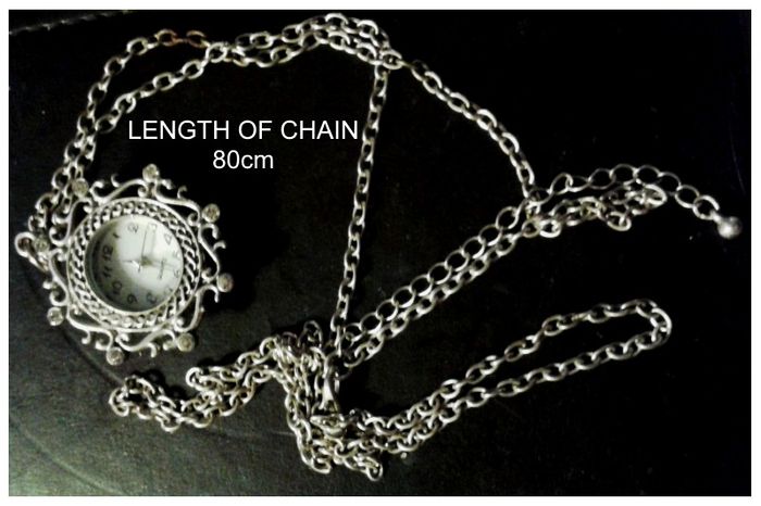 Ladies Quartz Necklace Watch with Filigree Design on Casing and Surrounded by 8 White-Silver Diamante Stones.