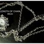 Ladies Quartz Necklace Watch with Filigree Design on Casing and Surrounded by 8 White-Silver Diamante Stones. Image 8