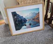 Framed lake mountain landscape scene