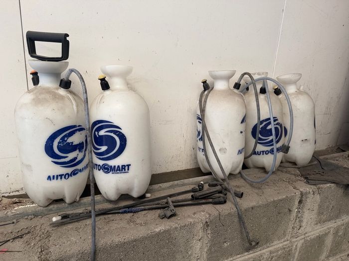 5 old pump bottles and parts
