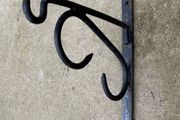Antique forged and welded iron sign hangers