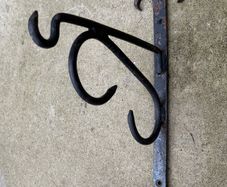Antique forged and welded iron sign hangers