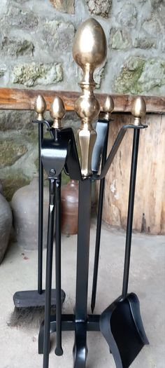 Antique Fire dogs and 4 piece fire set solid brass tops and steel