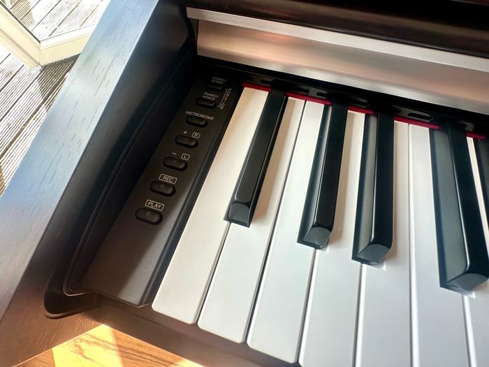 Yamaha Arius YDP-142 Digital Piano with rosewood finish and matching stool