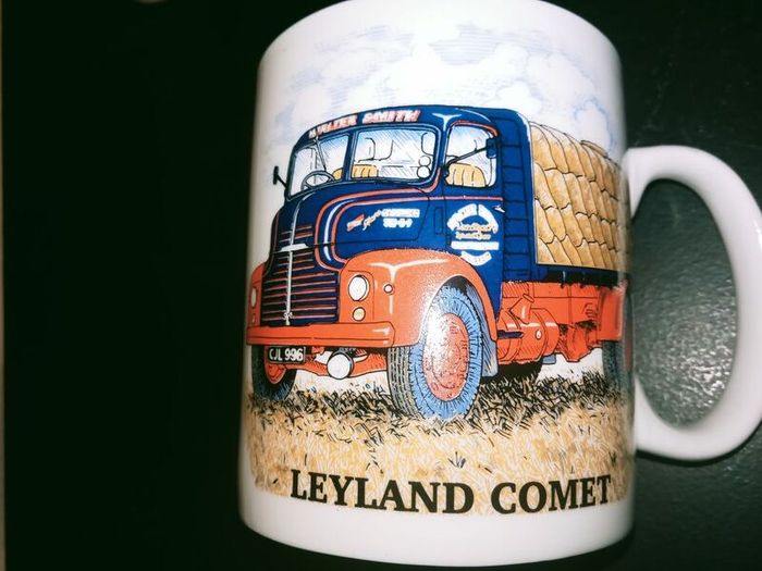 collection of six automotive mugs