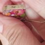 Handcrafted 925 sterling silver necklace with a heart-shaped pendant featuring a floral pattern. Image 3
