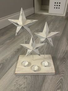 Tee light candle holder with 3 metal stars