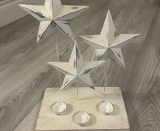 Tee light candle holder with 3 metal stars