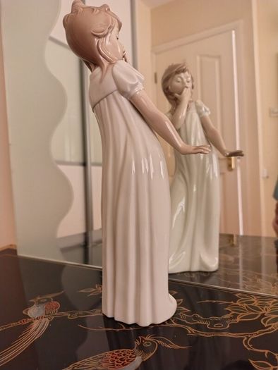 Nao by Lladro.  Yawning Girl. Damaged.