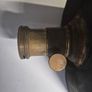 The object in the image is a vintage antique camera Image 7