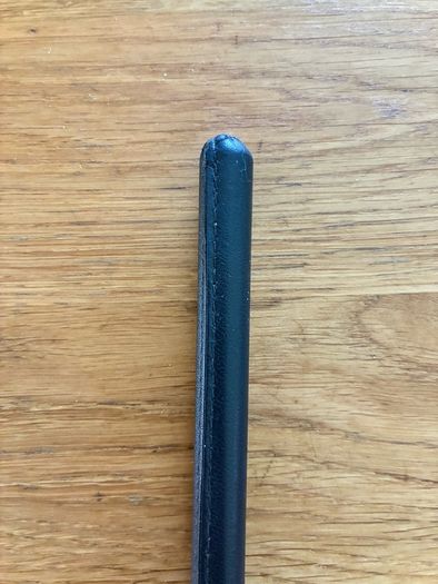 Brand new black leather showing cane