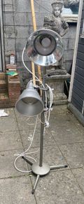 floor lamp This mid-century vintage industrial  floor lamp features twin adjustable reflectors (one fixed pole mount and one clamp-on mount).