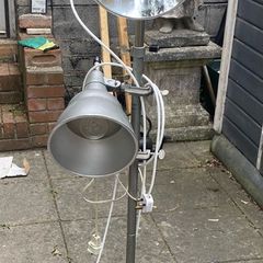 floor lamp This mid-century vintage industrial  floor lamp features twin adjustable reflectors (one fixed pole mount and one clamp-on mount).